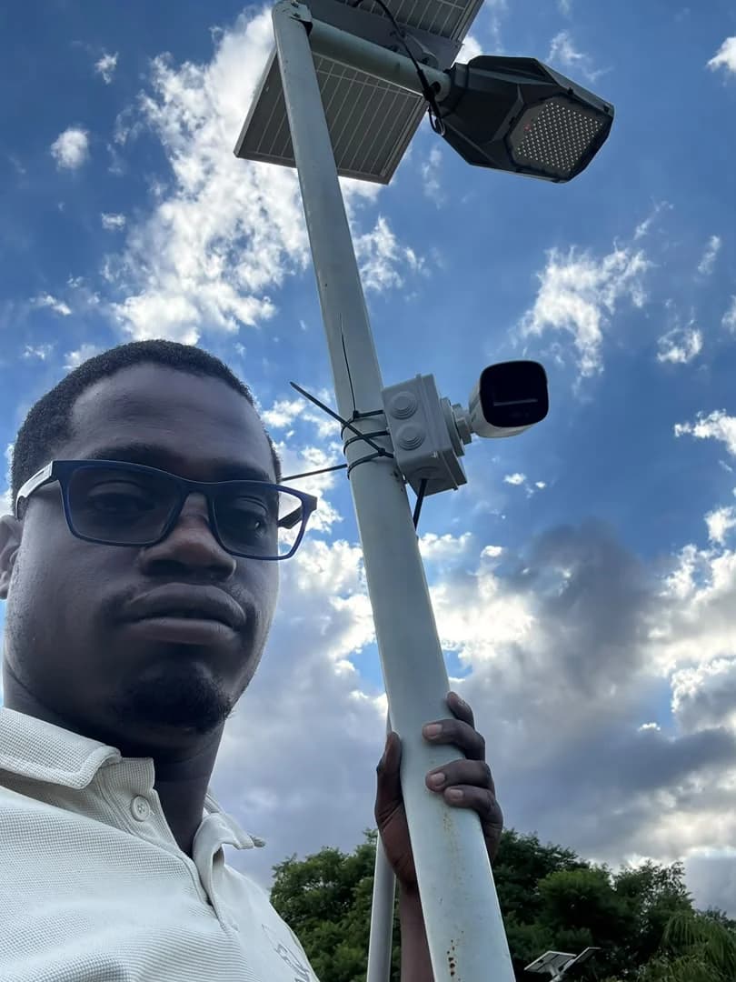 Outdoor camera installed on a pole beside solar lighting equipment